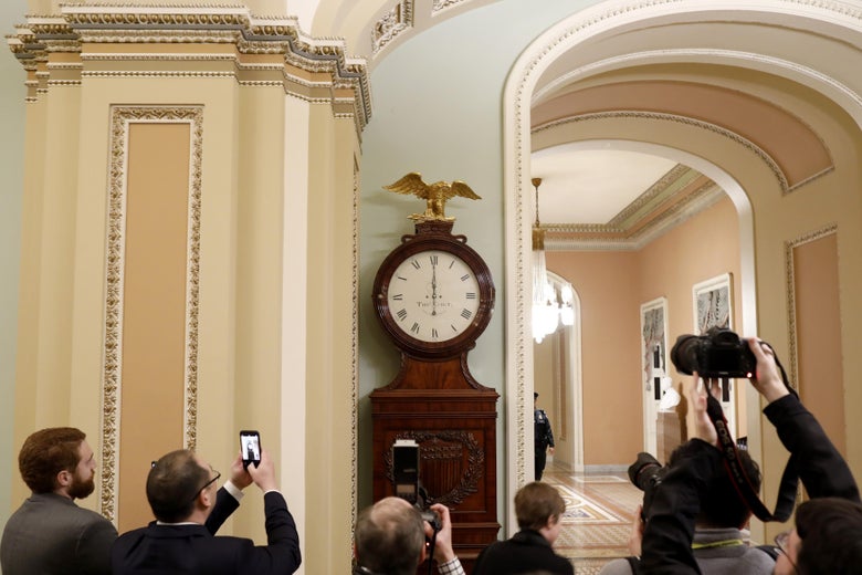 The Ohio Clock outside the Senate Chamber strikes midnight at the U.S. Capitol January 20, 2018 in Washington, DC. Lawmakers were unable to pass a continuing resolution in time to avert a government shutdown.